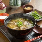 Japanese Clear Soup A Soul‑Soothing Broth Japanese clear soup Japanese clear soup in black bowl with mushrooms and scallions