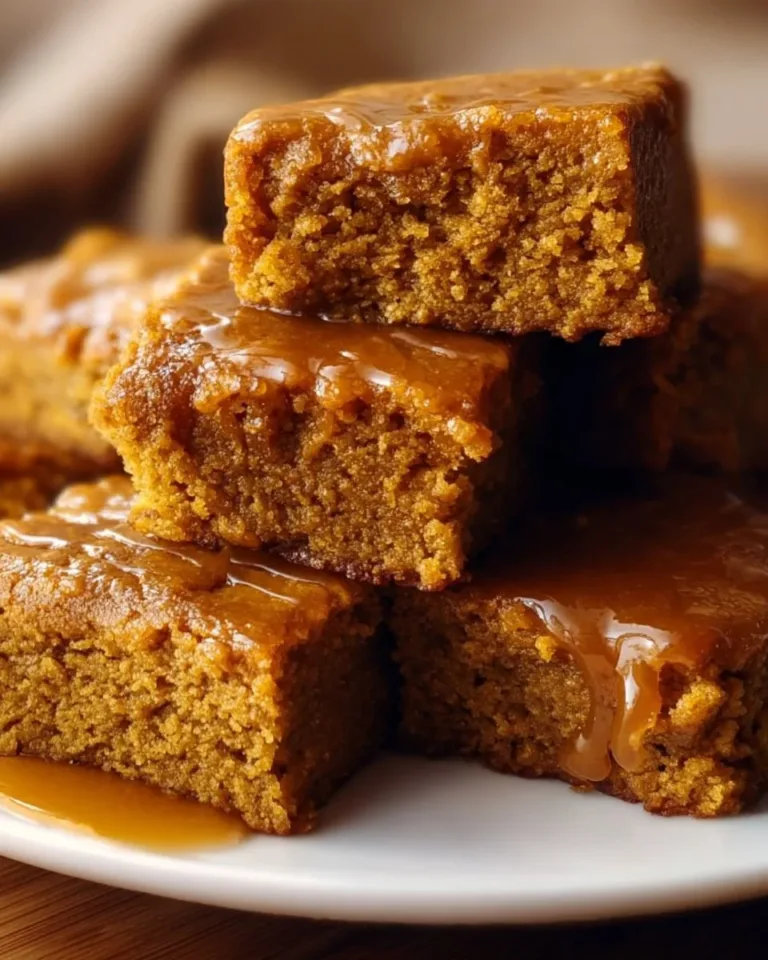 Vegan gluten-free pumpkin maple blondies topped with maple syrup drizzle